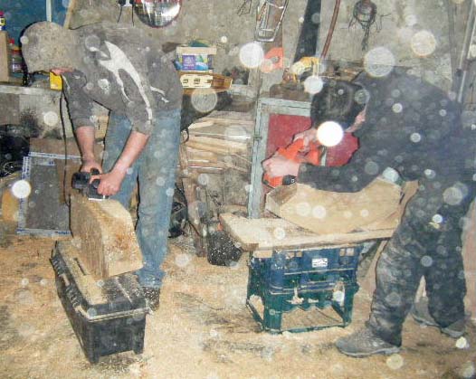 A sawdust snowstorm as James and Cathal plane their blocks. Photo: SR.